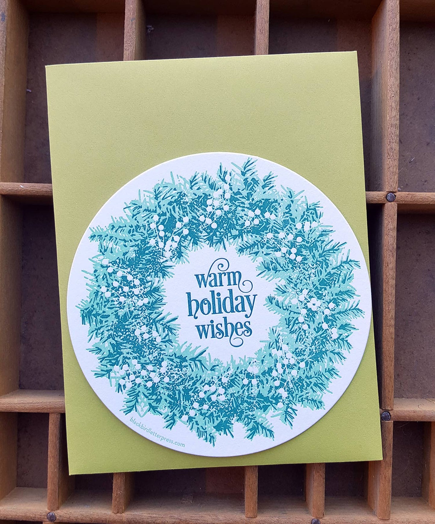 Warm holiday wishes wreath circle card