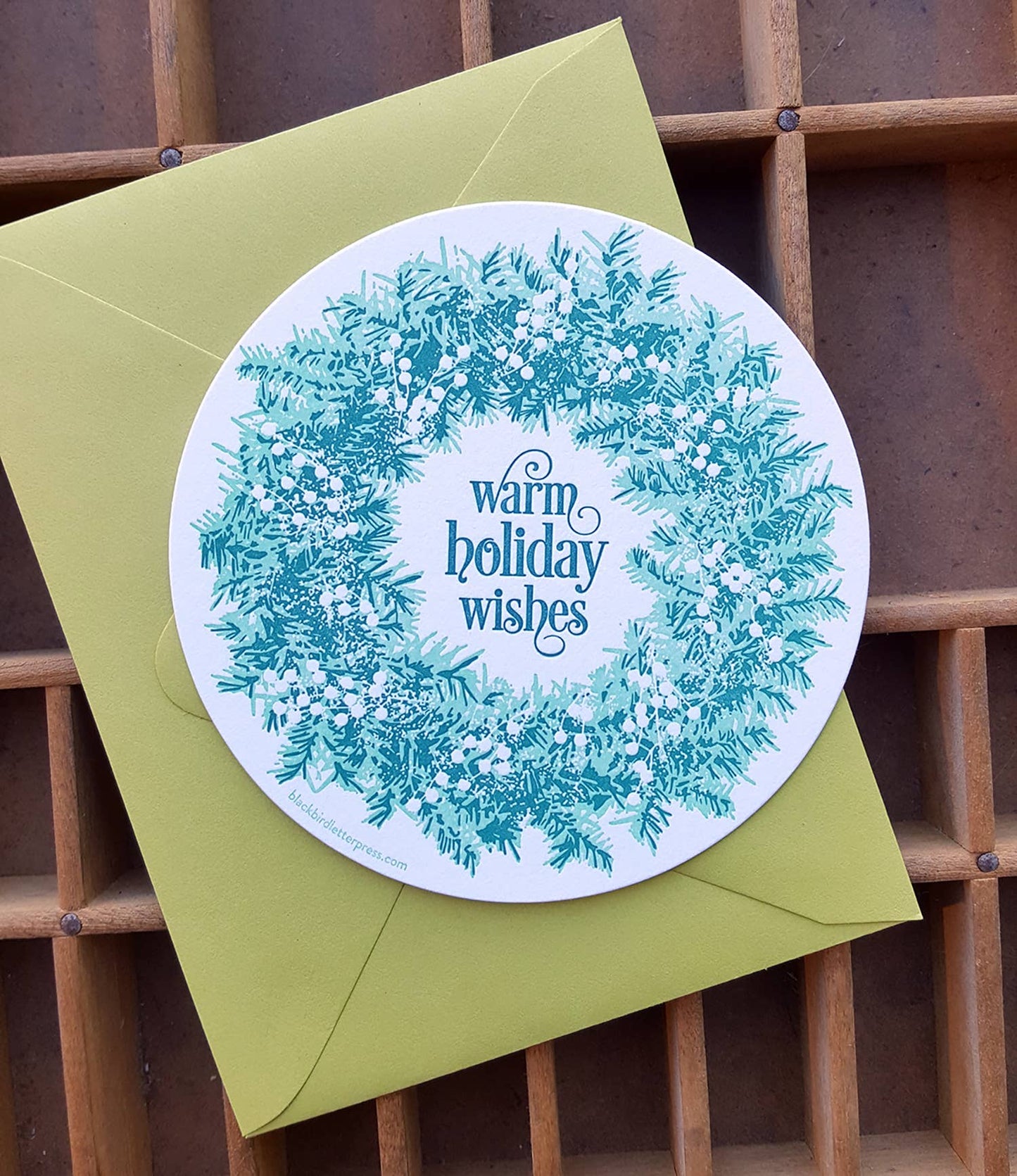 Warm holiday wishes wreath circle card