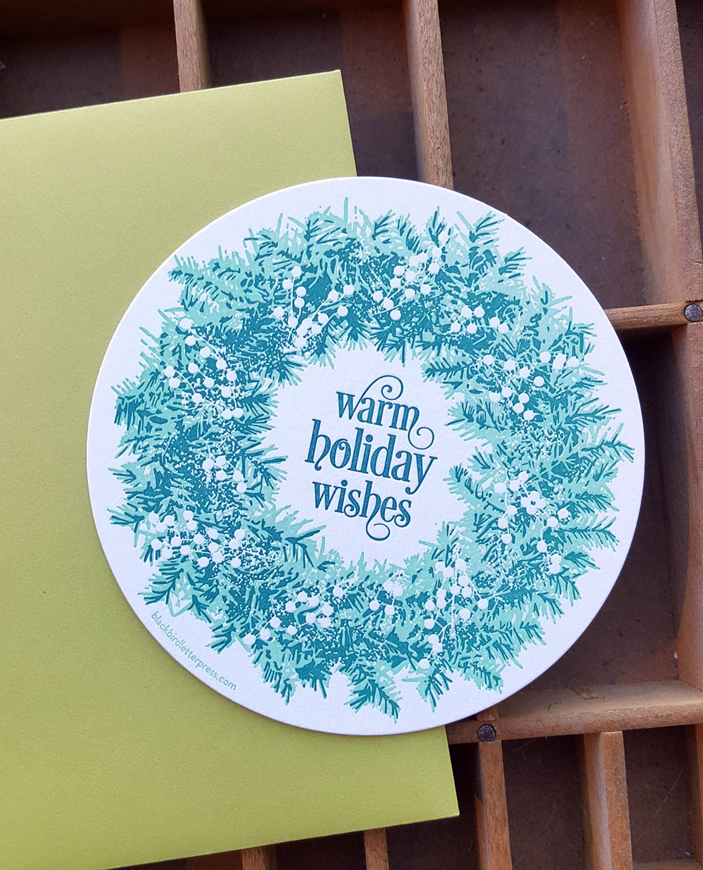 Warm holiday wishes wreath circle card